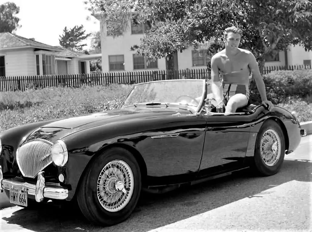 Clint Eastwood with his Austin Healey, in Los Angeles, CA - 1956.webp