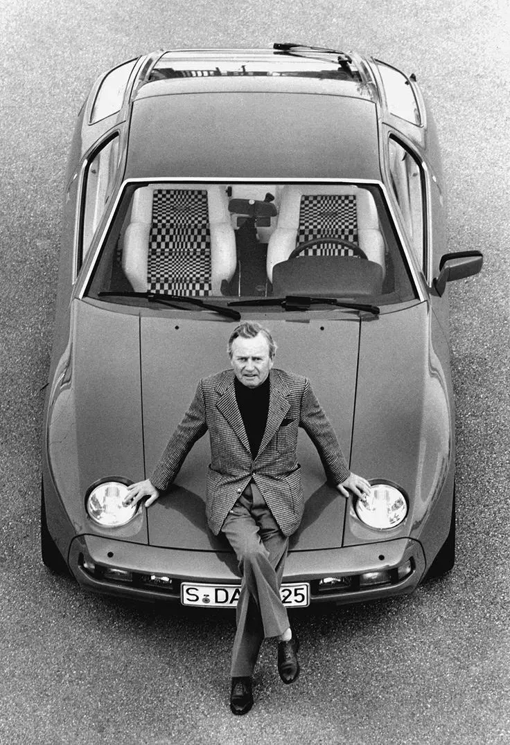 Dr. Ferry Porsche (son of Ferdinand) with a Porsche 928..webp